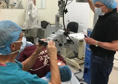 Eye Dr.'s performing eye procedure on patient.