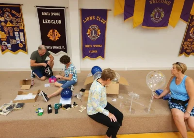 THE FLORIDA LIONS EYE CLINIC Volunteers helping set up an event